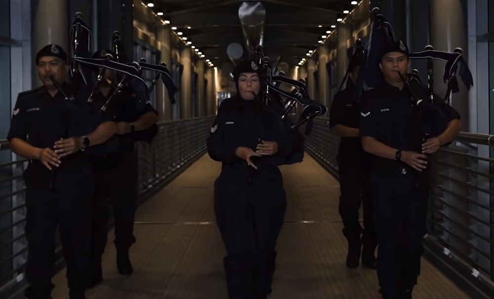 The bagpipe unit of the marching band performing in the music video. — Screengrab via Youtube/RMP TV Channel