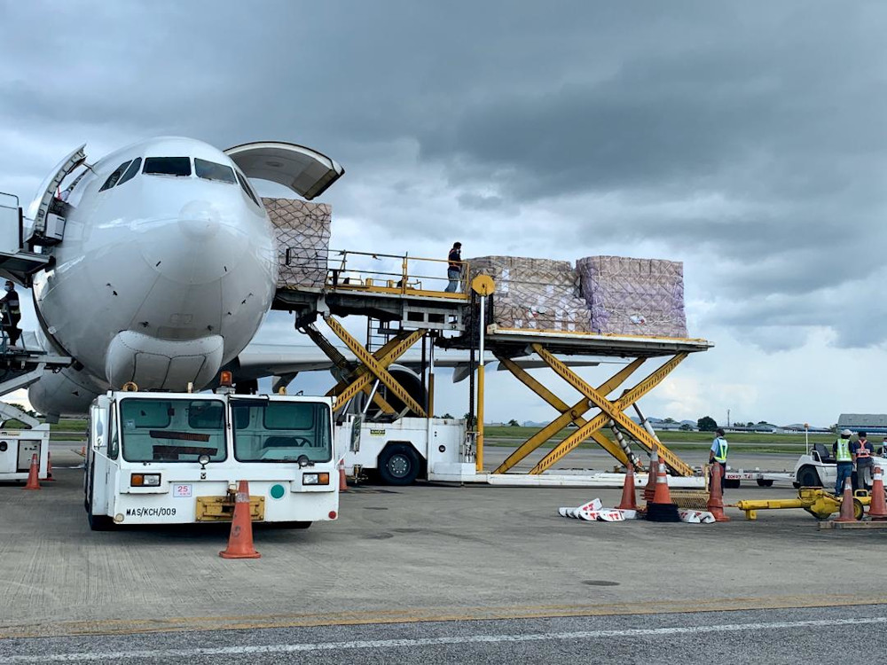 The unloading of the personal protective equipment from the plane at the Kuching International Airport, April 9, 2020. u00e2u20acu201d Picture courtesy of Sarawak Public Communications Unit (UKAS)