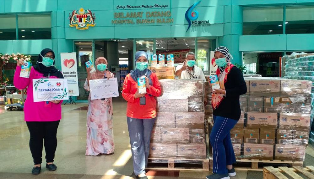 Dutch Lady Milk Industries Berhad delivers packs of Dutch Lady milk to medical frontliners at Sungai Buloh Hospital. u00e2u20acu201d Picture courtesy of Dutch Lady Milk Industries Berhad