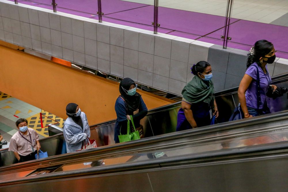 People observe social distancing during rush hour at the Ampang Park LRT station in Kuala Lumpur April 28, 2020. u00e2u20acu201d Picture by Firdaus Latif