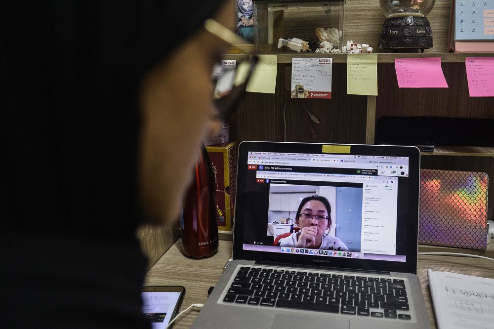 A student takes online lessons during phase three of the movement control order in Shah Alam April 15, 2020. u00e2u20acu201d Picture by Miera Zulyana
