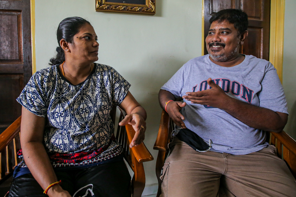 Sumathy Kaliappan (left) and her husband Muruga Marimuthu speak to Malay Mail during an interview at PPR Kerinchi in Kuala Lumpur April 3, 2020. ― Picture by Hari Anggara