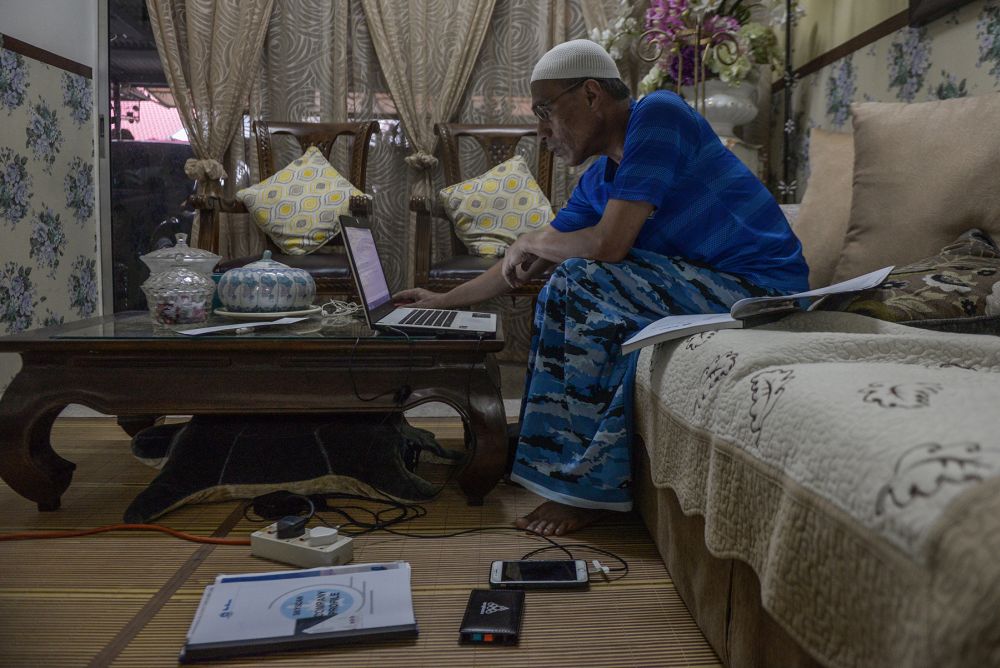 A man works from the comfort of home during phase three of the movement control order in Shah Alam April 15, 2020. — Picture by Miera Zulyana