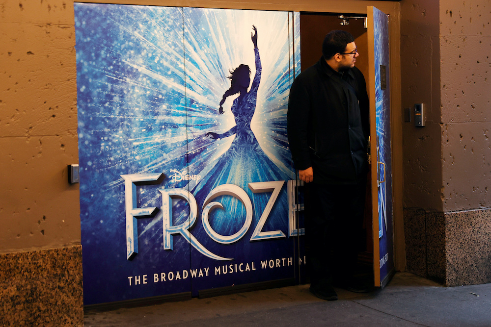 A worker looks out from the closed St James theatre where the musical Frozen plays after it was announced that Broadway shows will cancel performances due to the coronavirus outbreak in New York March 12, 2020. u00e2u20acu201d Reuters pic