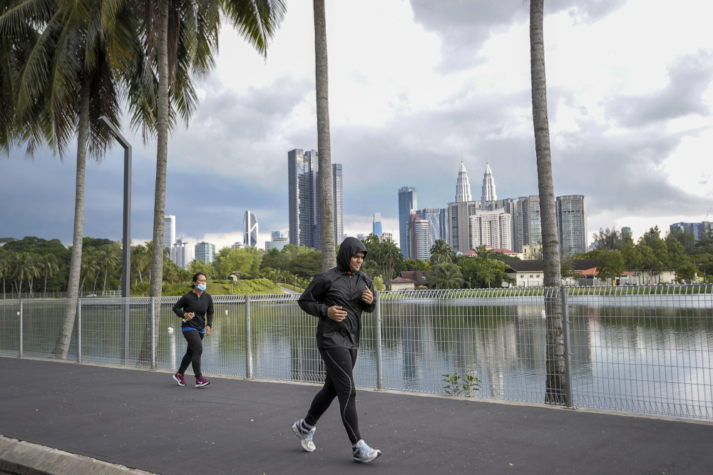 A view of people jogging at the Titiwangsa lake park in Kuala Lumpur May 4, 2020. — Picture by Shafwan Zaidon