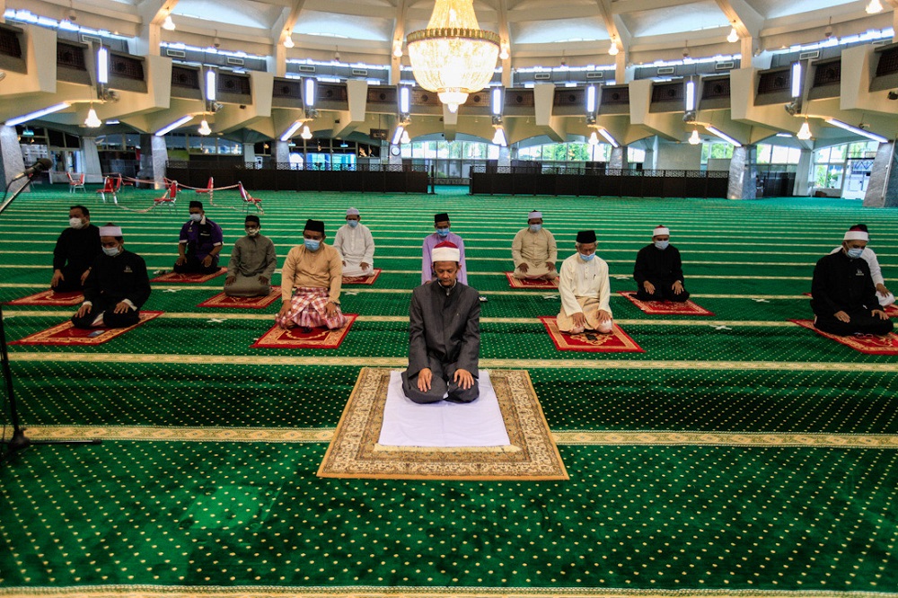 Imam Mohd Nordin Samah (centre) leads the Friday prayers at the Penang State Mosque in George Town May 22, 2020. u00e2u20acu201d Picture by Sayuti Zainudin