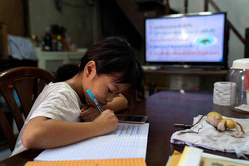 Orn-anong, 11, takes new online learning classes broadcast by state distance learning television (DLTV) amid the spread of Covid-19, at a community in Bangkok, Thailand, May 20, 2020. u00e2u20acu201d Reuters pic