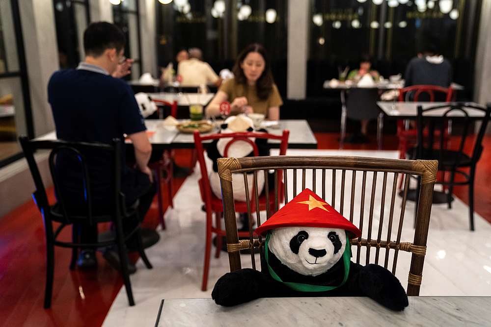 People have dinner as they sit next to stuffed panda dolls, used as part of social distancing measures, at the Maison Saigon restaurant in Bangkok, Thailand May 13, 2020. u00e2u20acu201d Reuters pic