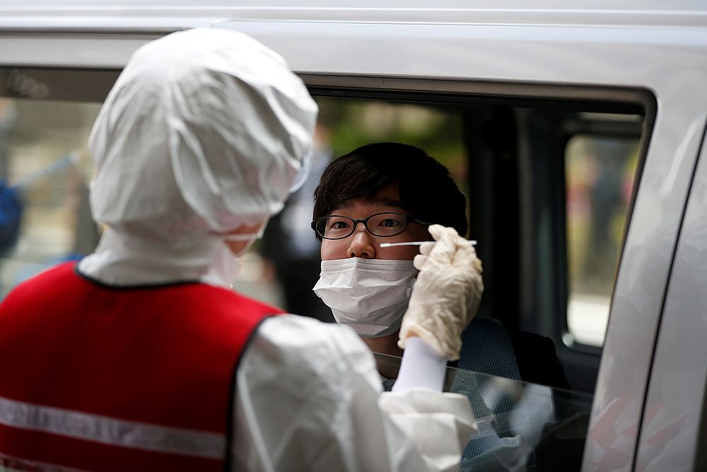 A medical worker conducts a simulation for drive-through polymerase chain reaction (PCR) tests for Covid-19 at Edogawa ward in Tokyo, Japan April 22, 2020. u00e2u20acu201d Reuters pic