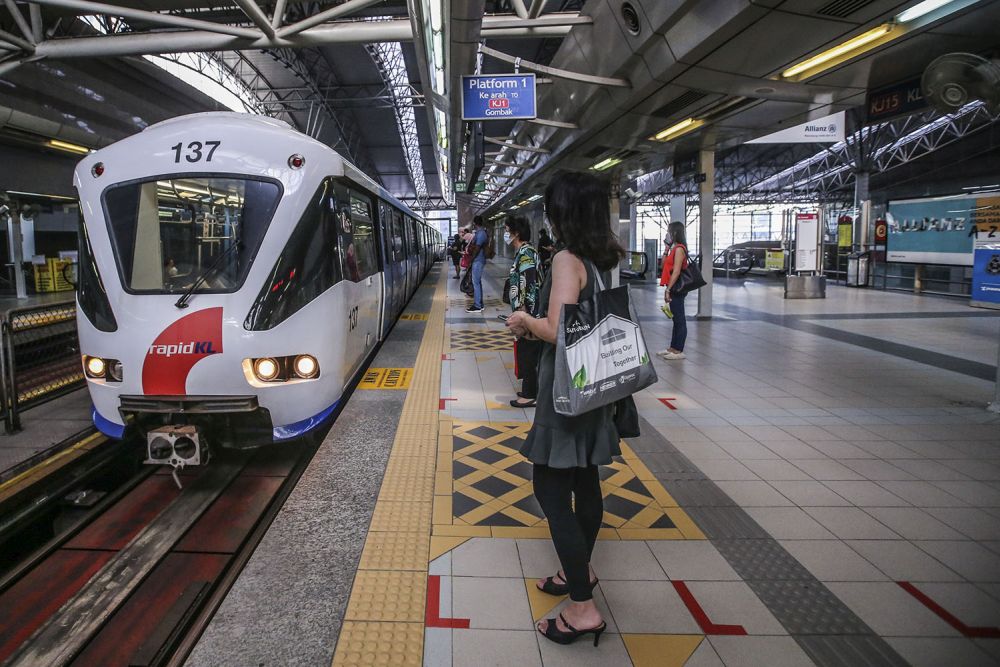 Commuters wait to board a train at the KL Sentral LRT station on the first day of the conditional movement control order in Kuala Lumpur May 4, 2020. u00e2u20acu201d Picture by Hari Anggara