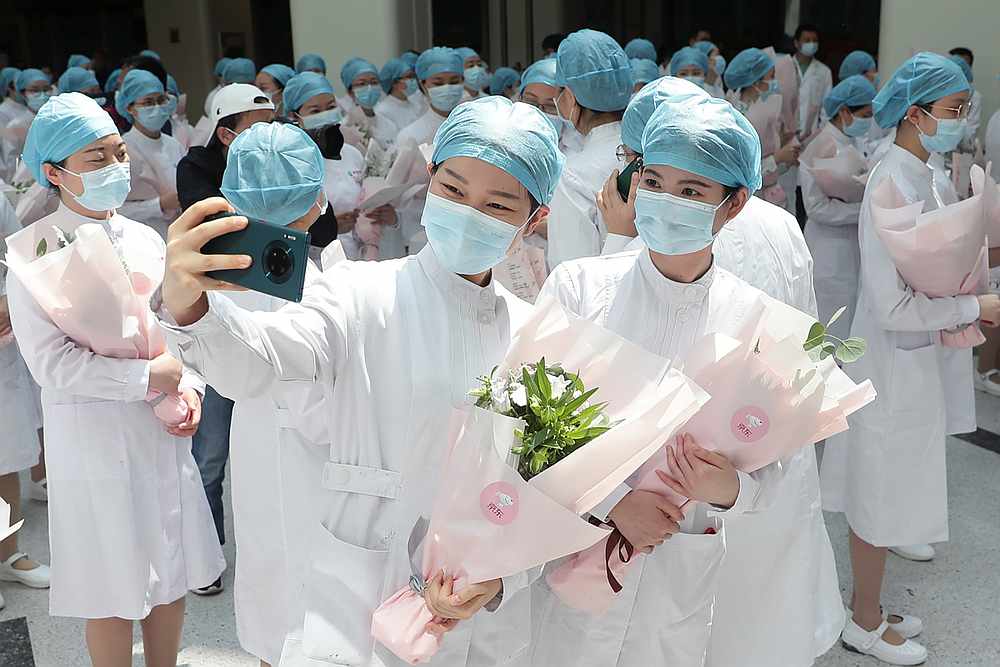 Nurses wearing face masks during an event held to mark the International Nurses Day, at Wuhan Tongji Hospital in Wuhan, China May 12, 2020. u00e2u20acu201d China Daily pic via Reuters