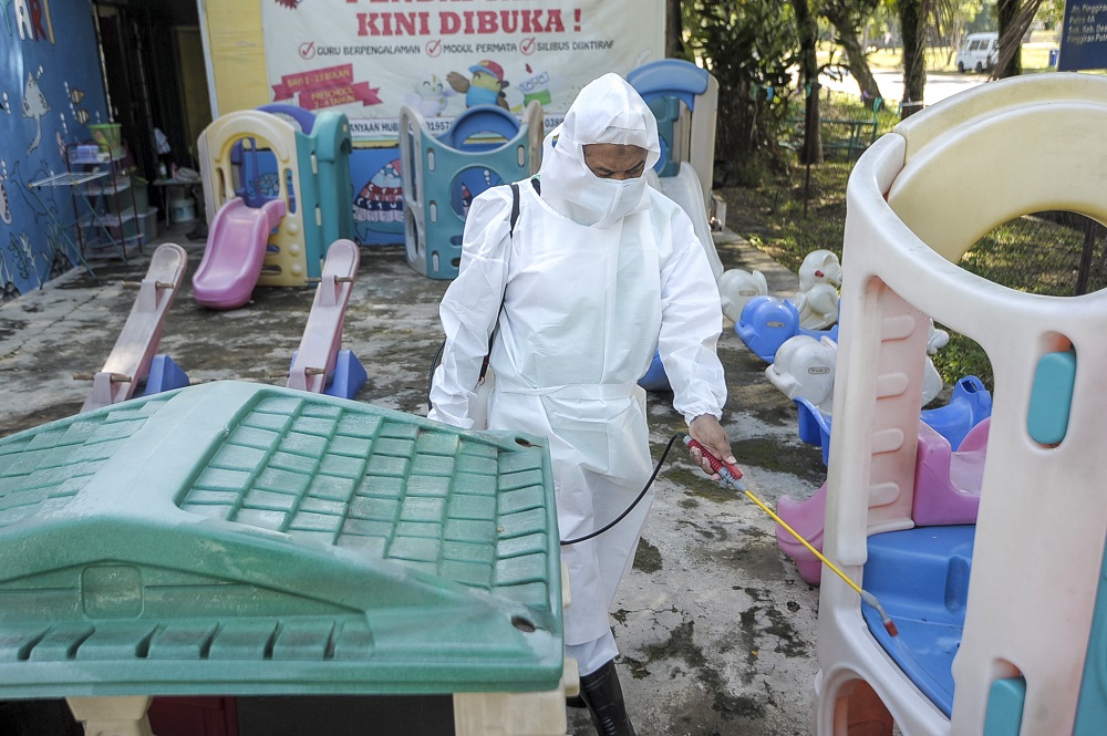 A staff member is seen disinfecting the playground area of a childcare centre in Kajang June 9, 2020 u00e2u20acu201d Picture by Shafwan Zaidon