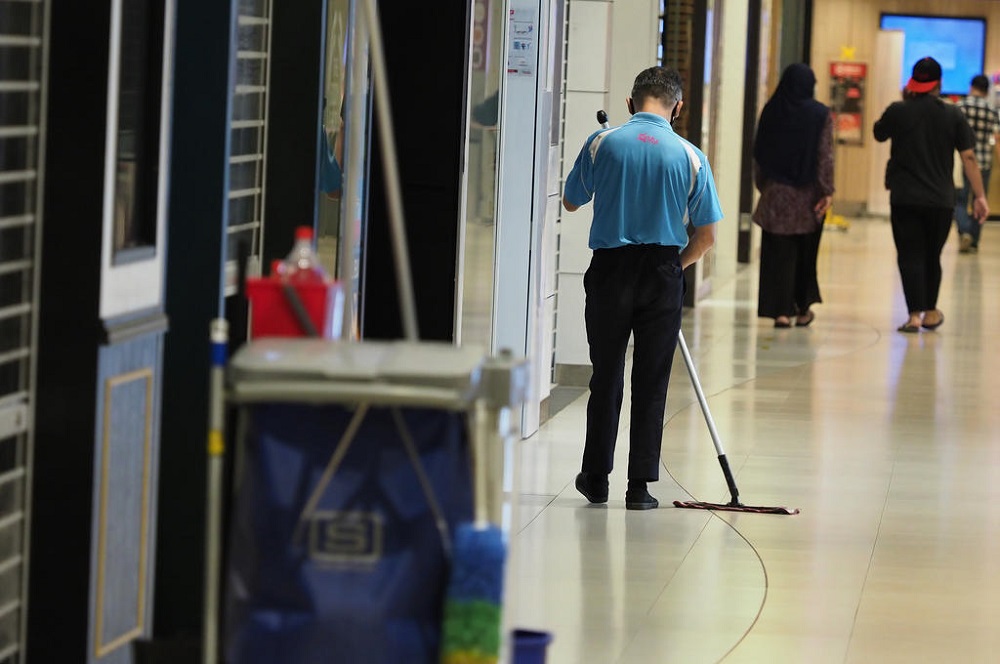 A cleaner mopping the floor of a mall in Bedok on June 9, 2020. During a debate on the Resilience Budget in April, Workersu00e2u20acu2122 Party chief Pritam Singh called for a thorough review of what constitutes a living wage in Singapore. u00e2u20acu201d TODAY pic