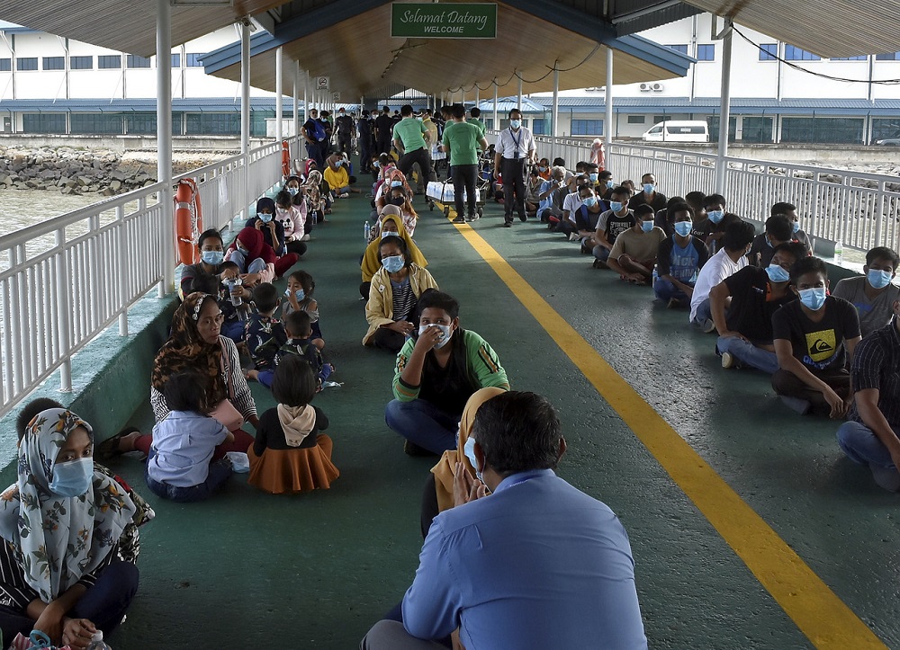 Illegal immigrants from Indonesia are seen at the Tawau Ferry Terminal June 3, 2020. u00e2u20acu201d Bernama pic