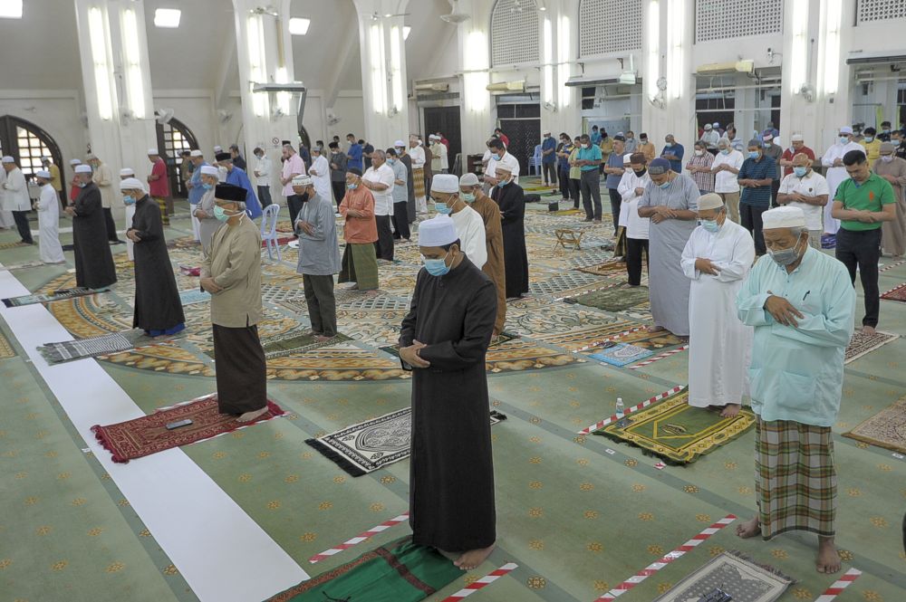 Malaysian Muslims observe social distancing while performing Friday prayers at the At-Taqwa Mosque during recovery movement control order in Kuala Lumpur June 12, 2020. u00e2u20acu201d Picture by Shafwan Zaidonn