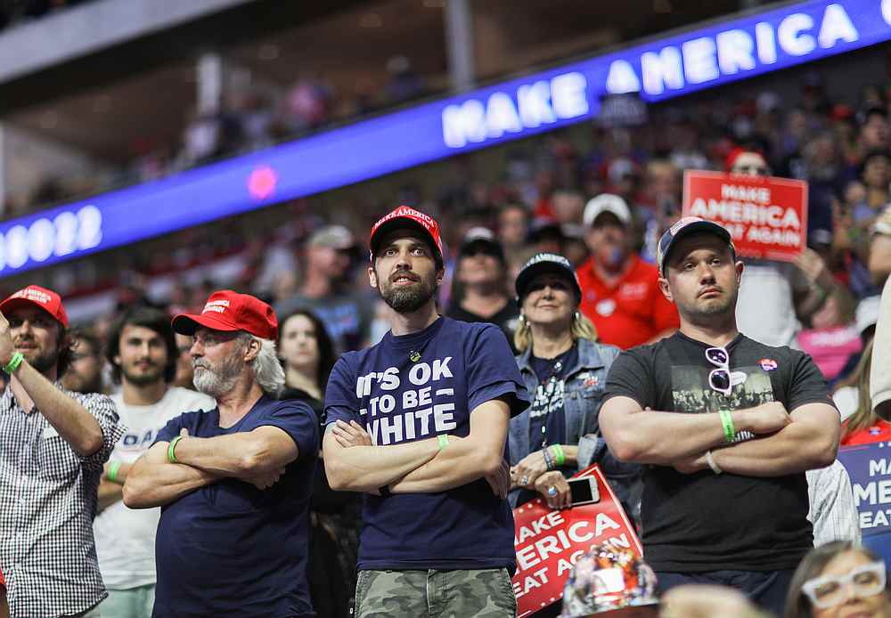 A Trump supporter wears a shirt reading 'It's OK To Be White' as the US president addresses his first re-election campaign rally in several months in Tulsa, Oklahoma June 20, 2020. u00e2u20acu201d Reuters pic