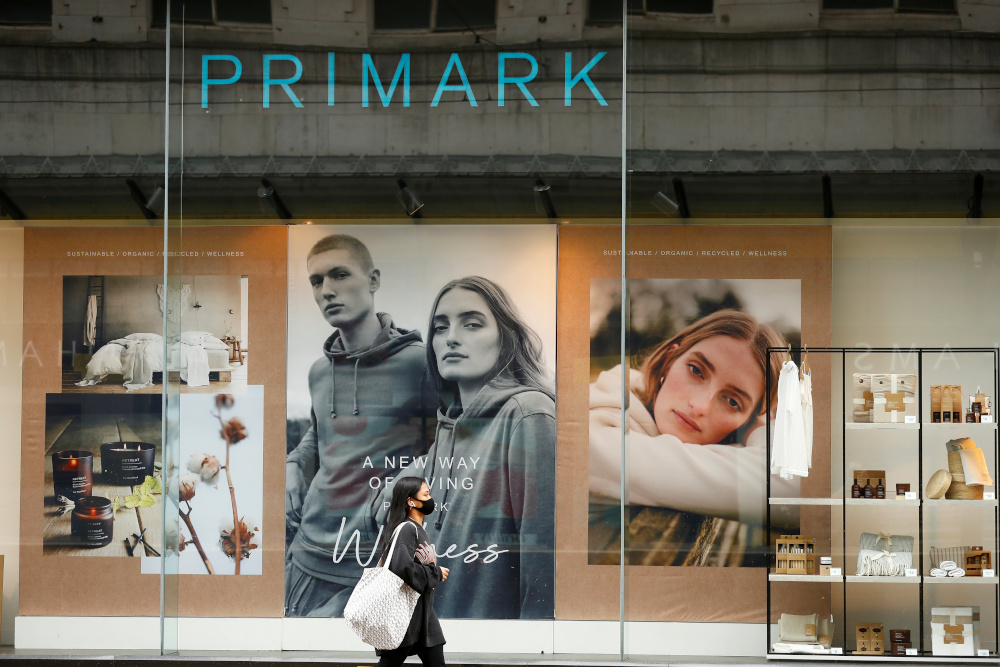 A woman wearing a face mask walks by a Primark store in Manchester, following the outbreak of the coronavirus disease, Manchester, Britain, May 26, 2020. u00e2u20acu201d Reuters picnn