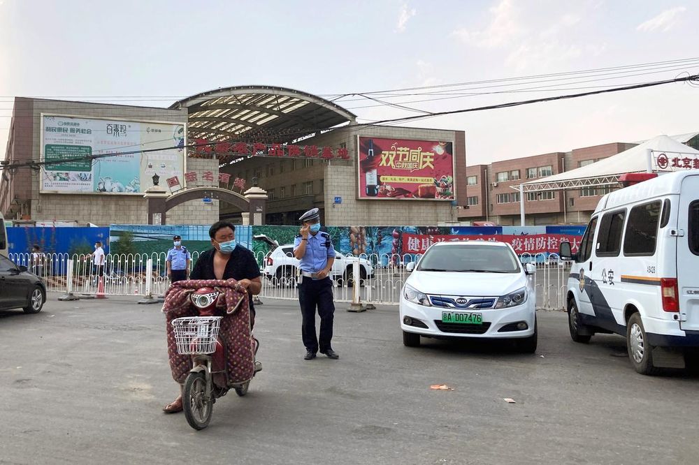 Police officers wearing face masks are seen outside the Xinfadi wholesale market, which has been closed for business after new coronavirus infections were detected, in Beijing, June 13, 2020. u00e2u20acu201d Reuters pic