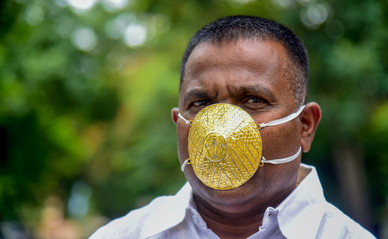 Businessman Shankar Kurhade wears a facemask made of gold and being worth 289,000 rupees amid concerns over the Covid-19 coronavirus outbreak, in Pune July 4, 2020. u00e2u20acu201d AFP pic