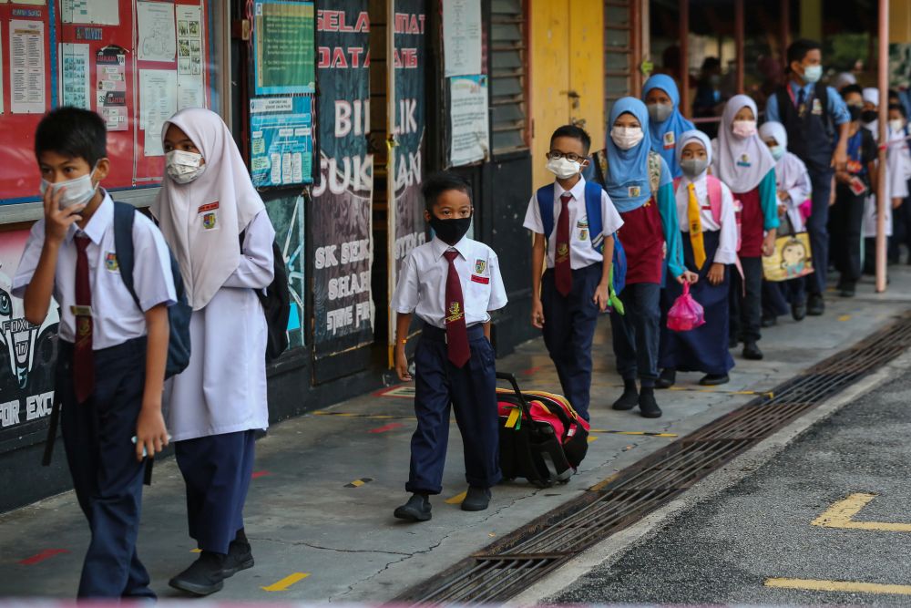 Sekolah Kebangsaan Section 7 students on their first day back at school in Shah Alam July 22, 2020. — Picture by Yusof Mat Isa