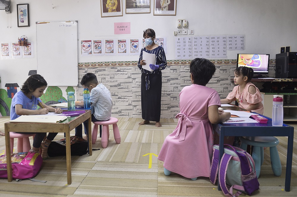 Pre-schoolers are seated accordingly to maintain social distancing in class at Tadika Bagus Bestari in Ara Damansara July 1, 2020. ― Picture by Miera Zulyana