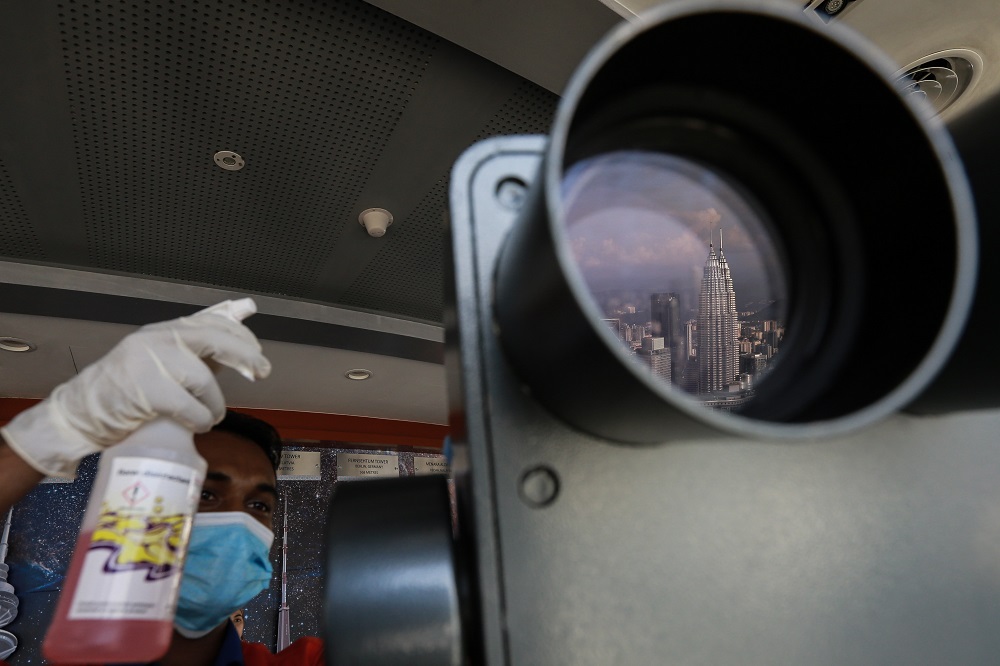 The Twin Towers are seen through a pair of binoculars in Kuala Lumpur July 21, 2020. ― Picture by Ahmad Zamzahuri