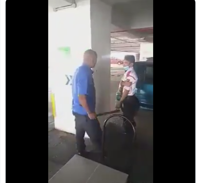 The video depicts a man speaking Bahasa Melayu confronting the unresisting guard and continually battering the latter with a truncheon in an unidentified car park. u00e2u20acu201d Twitter screencap