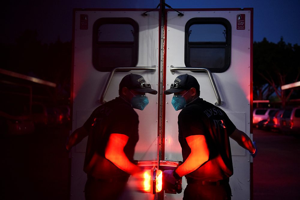 A firefighter tends to a non-Covid-19 patient while wearing protective equipment, against the spread of Covid-19, in Houston, Texas August 15, 2020. u00e2u20acu201d Reuters pic