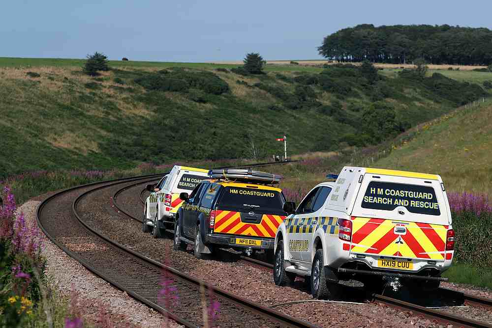 Emergency service vehicles ride along the tracks near the scene of a derailed passenger train, near Carmont, Stonehaven, Scotland, Britain August 12, 2020. u00e2u20acu201d Reuters pic