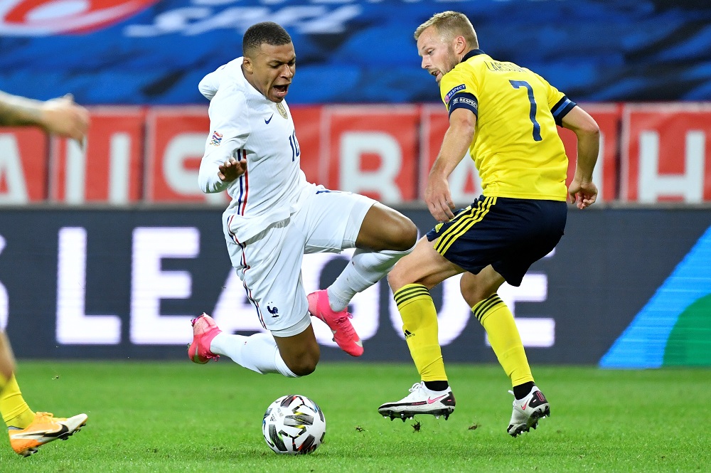 France's Kylian Mbappe and Sweden's Sebastian Larsson during the UEFA Nations League football match between Sweden and France at Friends Arena in Stockholm September 5, 2020. u00e2u20acu201d Picture by TT News Agency/Jessica Gow via Reuters