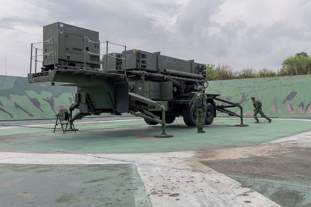 Soldiers are seen near military equipment at a Taiwan air defence missile base at an undisclosed location in this handout photo released September 11, 2020. u00e2u20acu201d Picture by Taiwan Presidential Office/Handout via Reuters