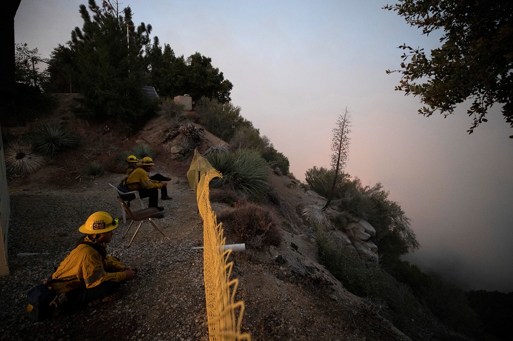 Firefighters watch as smoke rises near Mount Wilson Observatory from the Bobcat Fire in Los Angeles September 14, 2020. u00e2u20acu201d Reuters pic