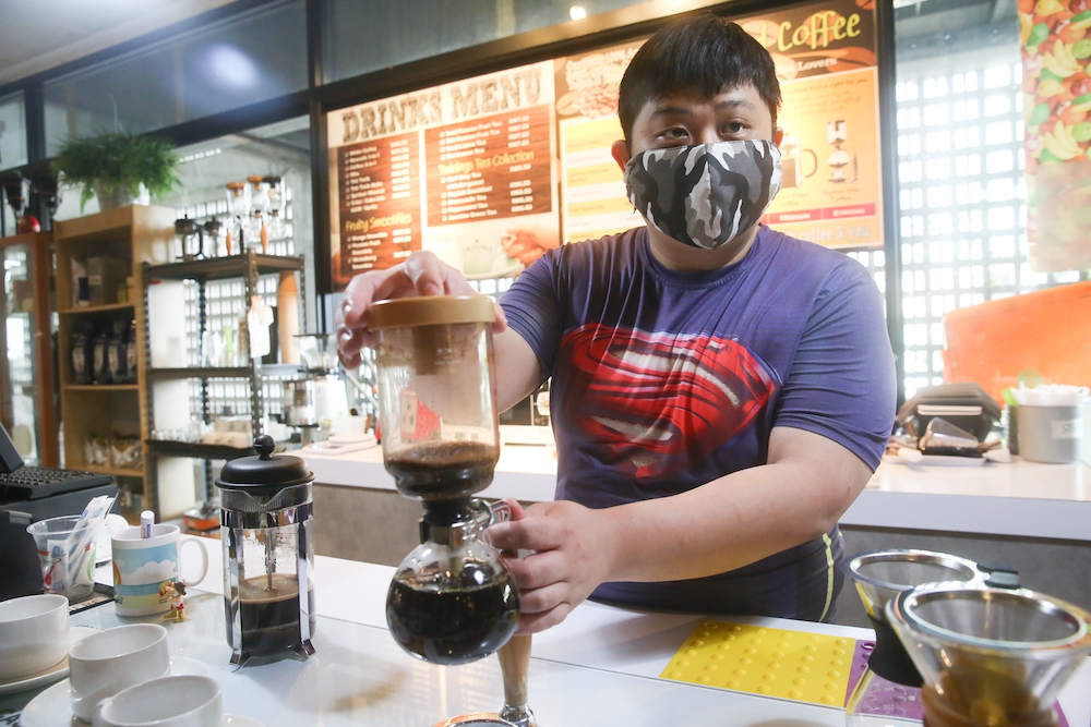 Kok started studying to become a full-fledged barista after one of his friends encouraged him to pick up latte art. u00e2u20acu201d Picture by Choo Choy May