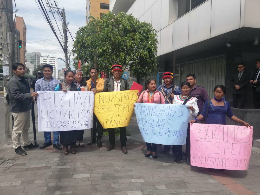 File photo of representatives of the Shiwiar, Sapara and Kichwa indigenous communities gather to deliver a statement opposing the government's state's auction of oil blocks without the free, prior and informed consent of affected communities, in Quito, Ec