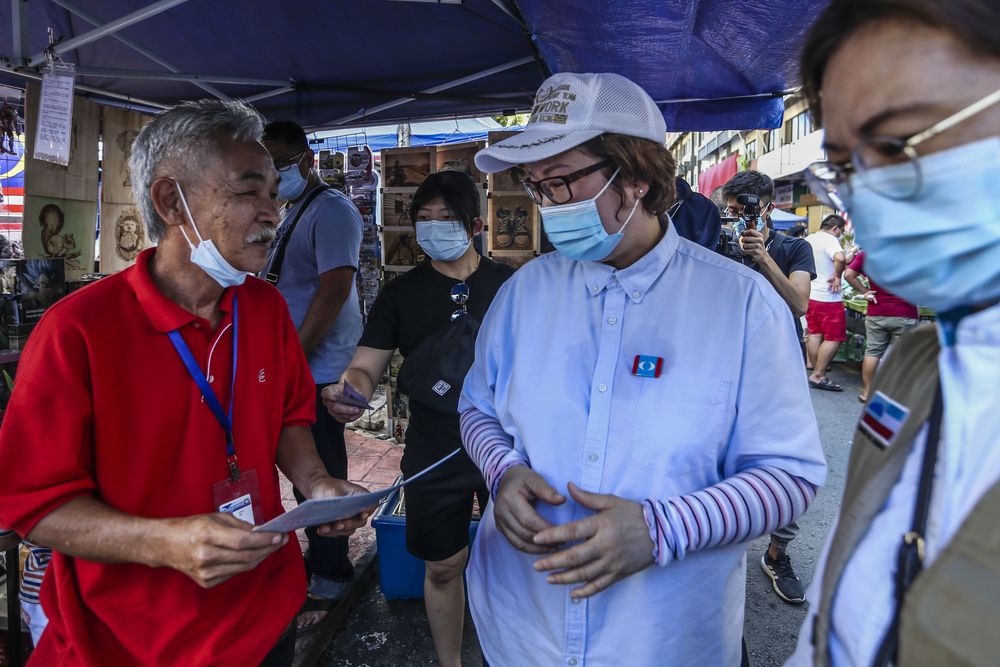 PKR party candidate for the Api-Api constituency Sabah PKR chairman Datuk Christina Liew during a walkabout at the Gaya Street (Sunday Market) in Kota Kinabalu, Sabah September 13, 2020. u00e2u20acu201d Picture by Firdaus Latif