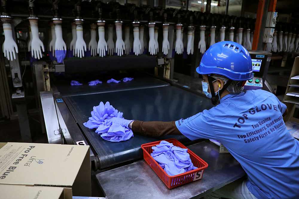 A worker at a production line in Top Glove factory in Shah Alam August 26, 2020. — Reuters pic