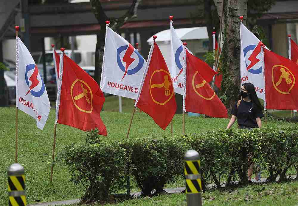 People's Action Party and Workers' Party flags in Hougang during the General Election 2020 hustings. u00e2u20acu201d TODAY pic