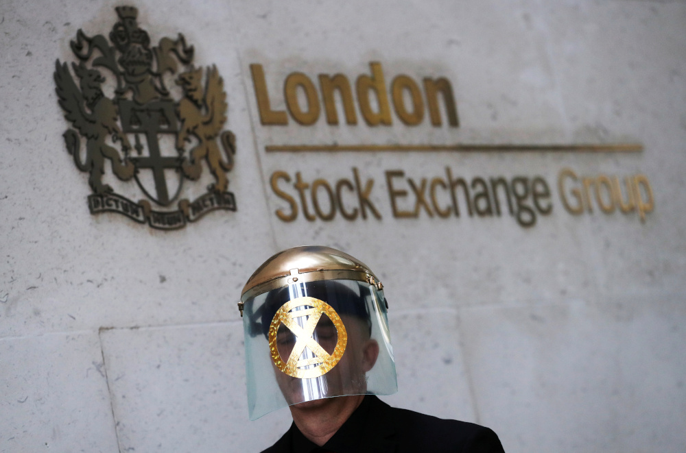 A man takes part in a demonstration at the London stock exchange during an Extinction Rebellion protest in London, Britain April 25, 2019. u00e2u20acu201d Reuters pic 