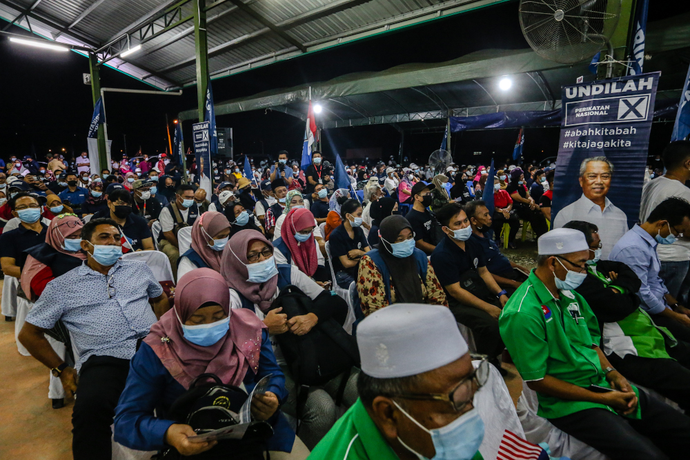 Perikatan Nasional supporters listen to a campaign speech by PN chairman Tan Sri Muhyidin Yassin in Putatan, Sabah September 24, 2020. — Picture by Firdaus Latif