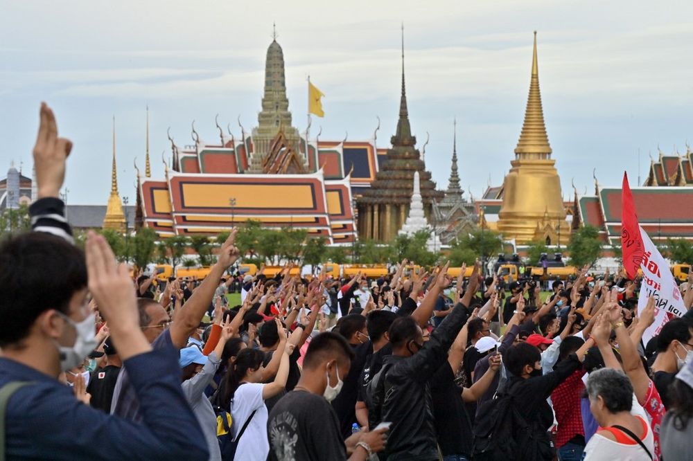 Pro-democracy protesters hold up the three-finger salute on Sanam Luang field next to the Grand Palace in Bangkok on September 20, 2020, following an overnight anti-government demonstration. u00e2u20acu201d AFP pic