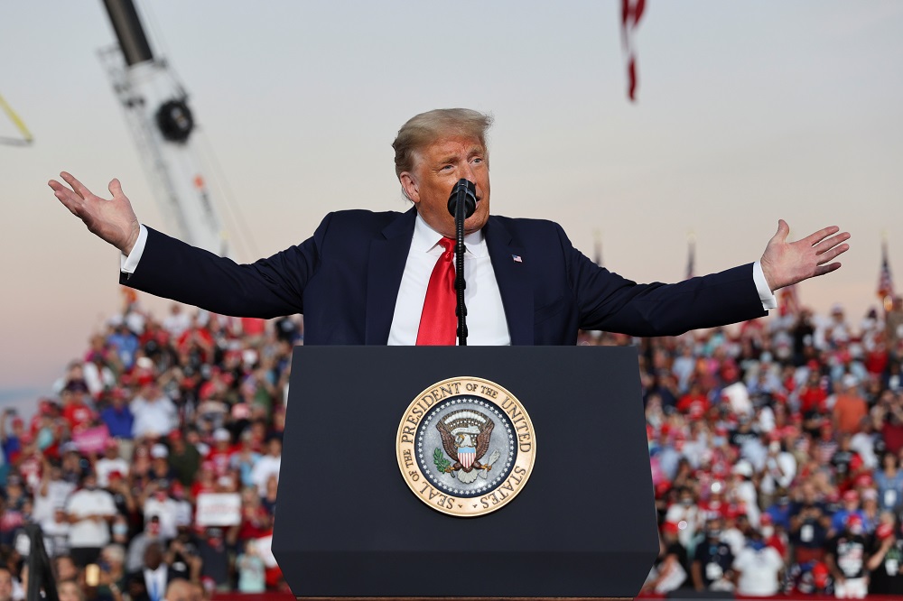 US President Donald Trump gestures during a campaign rally, his first since being treated for the coronavirus disease, at Orlando Sanford International Airport October 12, 2020. u00e2u20acu201d Reuters pic