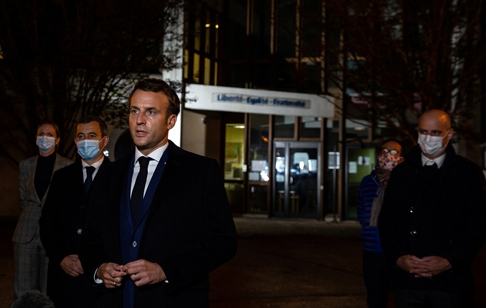French President Emmanuel Macron speaks to the press following a stabbing attack in the Conflans-Sainte-Honourine suburb of Paris October 16, 2020. — Reuters pic