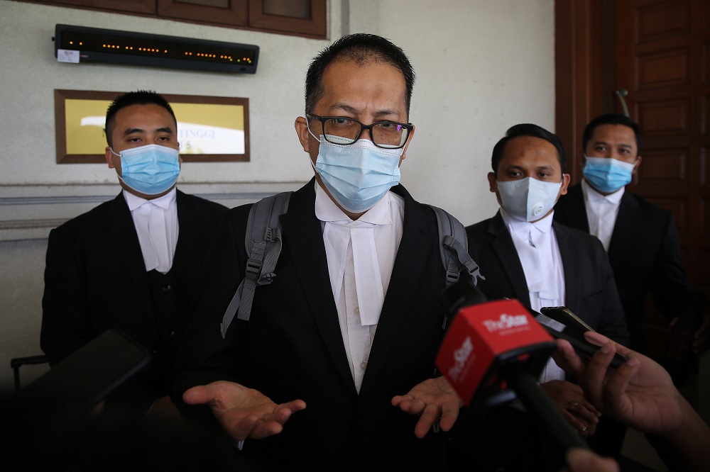 Datuk Hasanah Abdul Hamid’s lawyer, Hamdan Hamzah, speaks to reporters outside the courtroom at the Kuala Lumpur High Court October 5, 2020. — Picture by Yusof Mat Isa