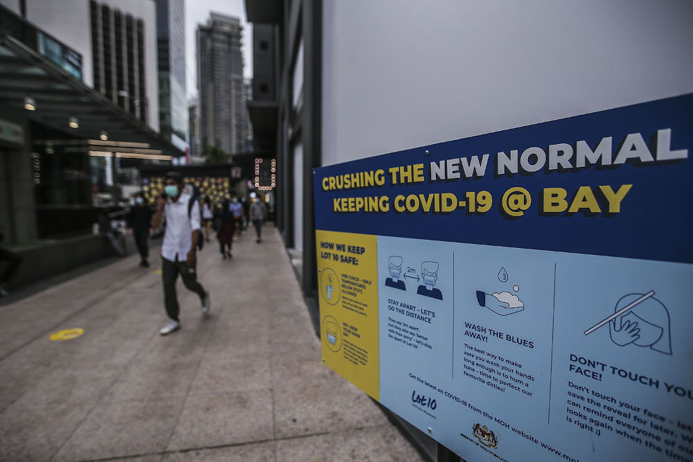 A poster displaying Covid-19 SOP issued by the government is seen in Kuala Lumpur October 11, 2020. — Picture by Hari Anggara