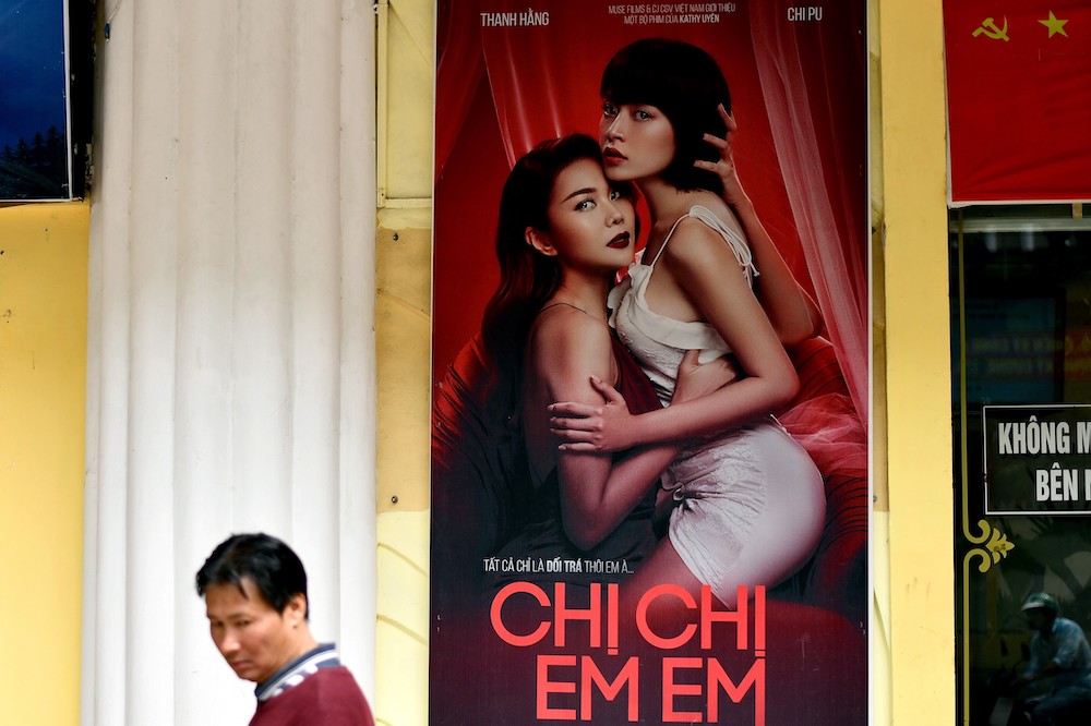 A man walks past a poster for the film u00e2u20acu02dcChi Chi Em Emu00e2u20acu2122 (Sister Sister), Vietnam's official entry at the 2020 Busan International Film Festival, outside a cinema hall in Hanoi. u00e2u20acu201d AFP pic