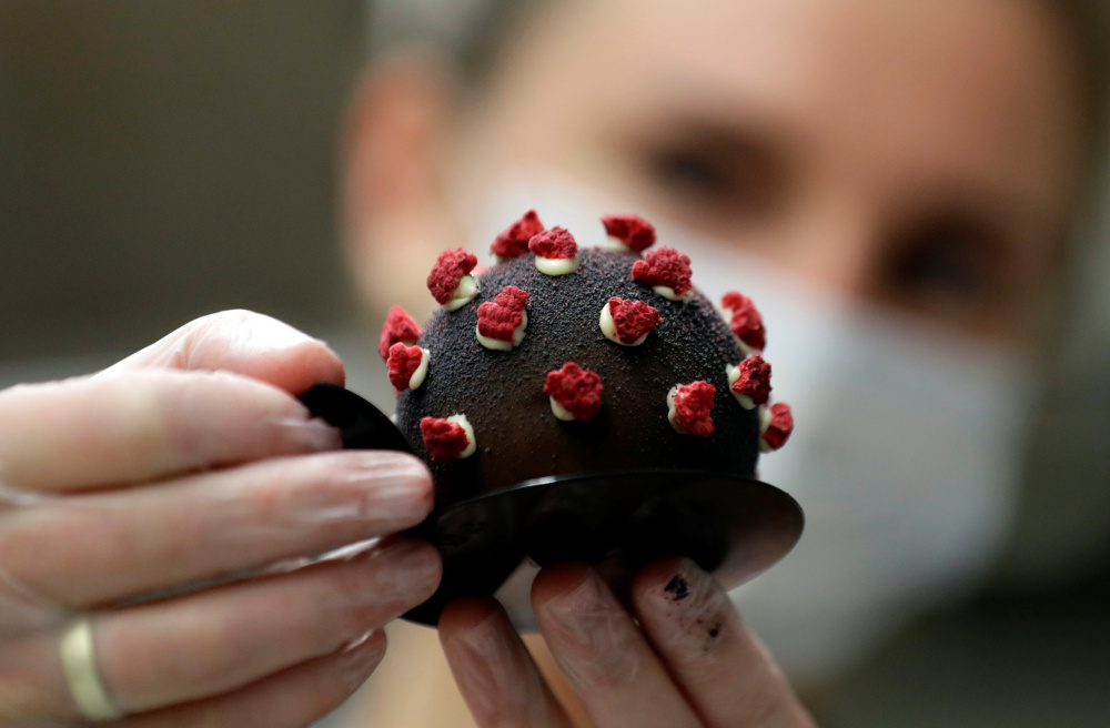 A confectioner arranges a cake shaped like a microscopic view of the coronavirus SARS-CoV-2 at a bakery, amid concerns about the spread of the disease in Prague, Czech Republic, October 6, 2020. u00e2u20acu201d Reuters picn