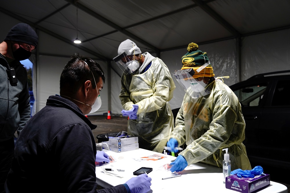 Health personnel process nasal swab samples at a drive-through testing site outside the Southside Health Centre as the coronavirus disease outbreak continues in Milwaukee, Wisconsin October 21, 2020. u00e2u20acu2022 Reuters pic