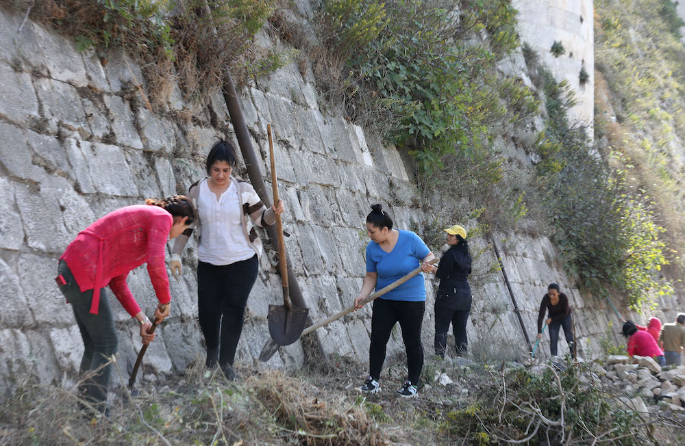 Volunteers take part in a clean-up at the medieval Crusader fortress Krak des Chevaliers, approximately 40 kilometres west of Syria's central city of Homs and close to the border with Lebanon. ― AFP pic