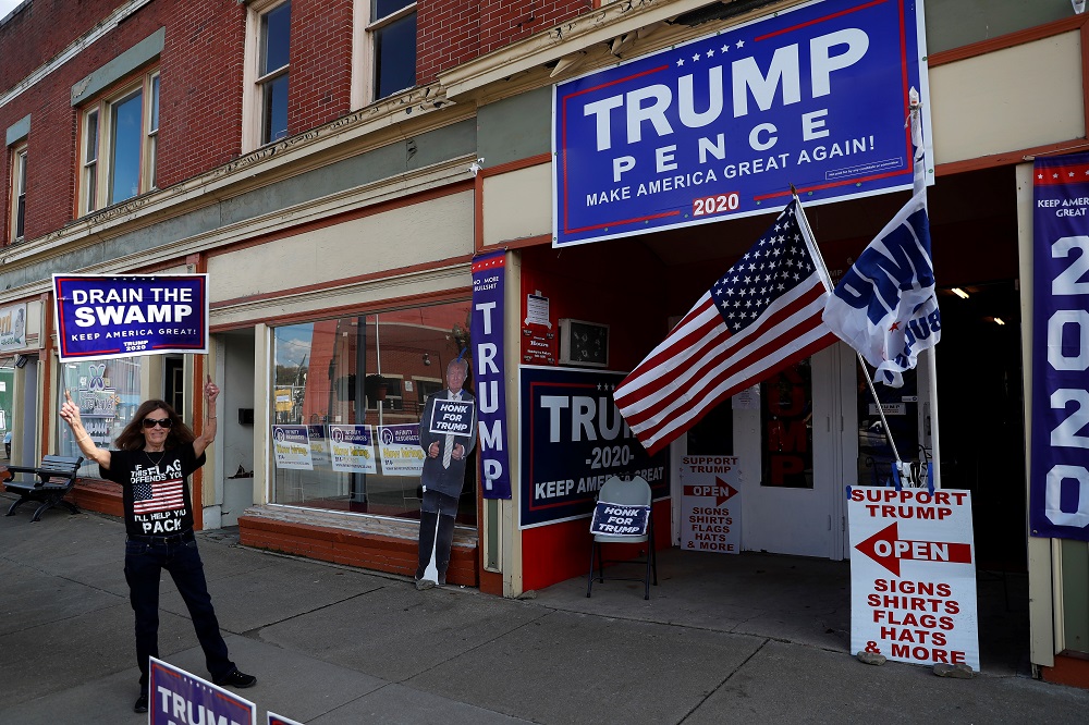 A supporter of US President Donald Trump holds a campaign sign outside the Republican headquarters in Union City, Pennsylvania October 23, 2020. u00e2u20acu2022 Reuters pic