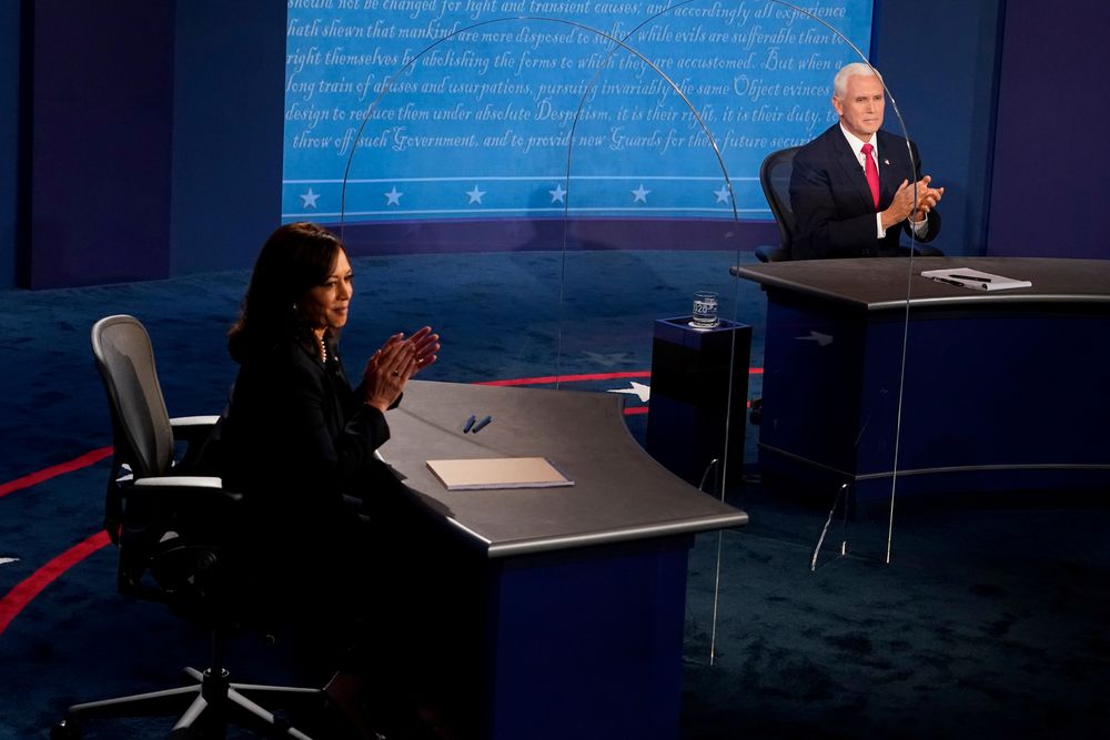 US Vice President Mike Pence and Democratic vice presidential nominee and US Senator Kamala Harris applaud at the end of the 2020 vice presidential debate on the campus of the University of Utah in Salt Lake City, Utah, October 7, 2020. — Reuters pic US Vice President Mike Pence and Democratic vice presidential nominee and US Senator Kamala Harris applaud at the end of the 2020 vice presidential debate on the campus of the University of Utah in Salt Lake City, Utah, October 7, 2020. — Reuters pic